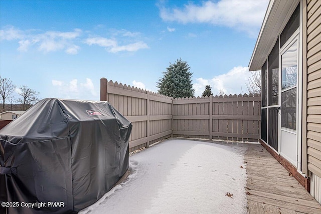 view of patio with a grill and fence