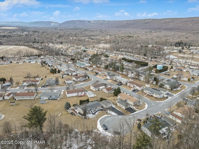 birds eye view of property with a residential view and a mountain view