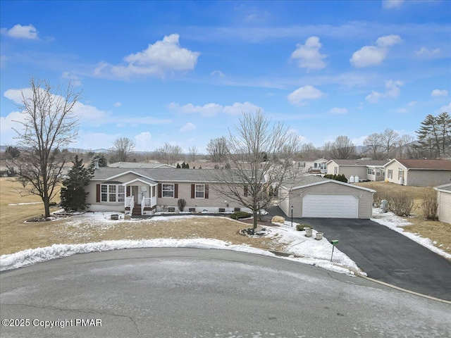 single story home with an outbuilding and a residential view