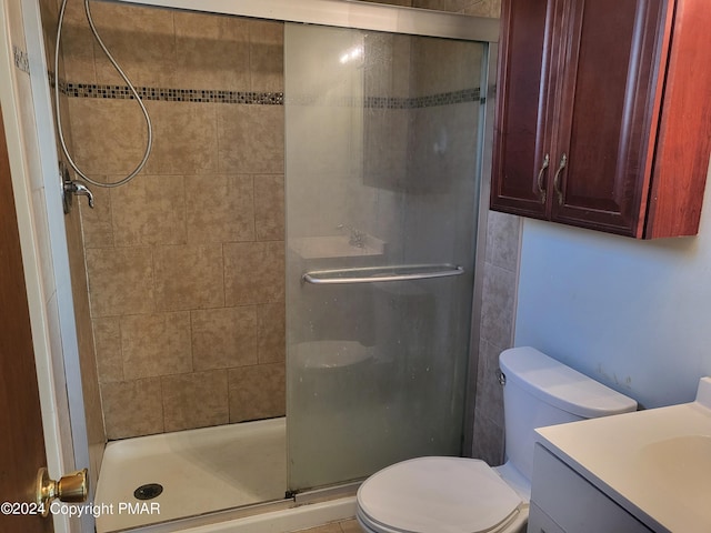 2153 Gravel Rd, Canadensis, PA 18325 - bathroom featuring toilet, a shower stall, and vanity