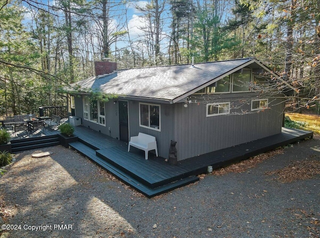1109 Cedar Knoll Way, Pocono Pines, PA 18350 - view of front of property with a chimney, a wooden deck, and a shingled roof