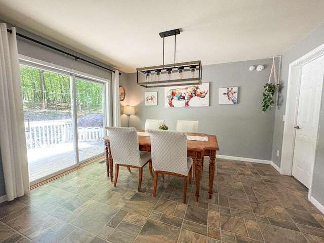 2236 Eagle Path, Bushkill, PA 18324 - dining area with baseboards and dark stone finish floors