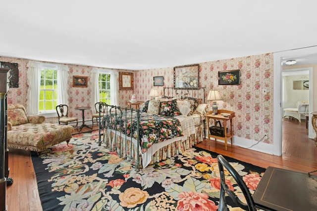 282 Crabapple Ln, East Stroudsburg, PA 18302 - bedroom with wallpapered walls and wood finished floors