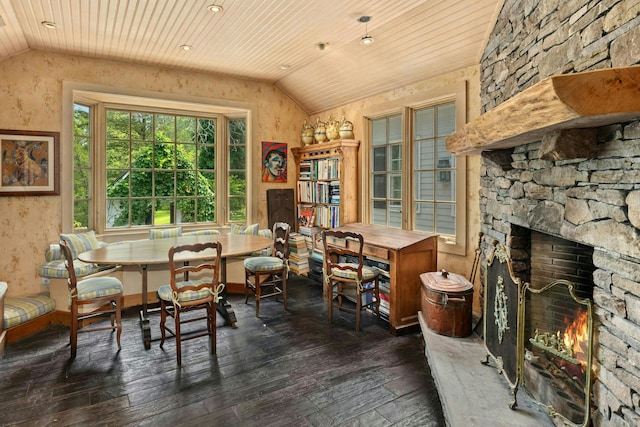 282 Crabapple Ln, East Stroudsburg, PA 18302 - dining room with lofted ceiling, wood ceiling, dark wood-type flooring, and a stone fireplace