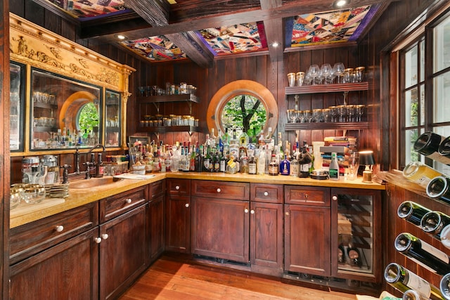 282 Crabapple Ln, East Stroudsburg, PA 18302 - indoor wet bar with coffered ceiling, wooden walls, beam ceiling, and light wood-style flooring
