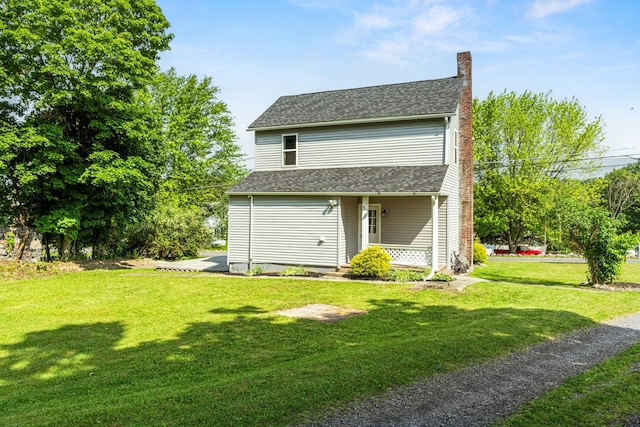 490 Richmond Rd, Bangor, PA 18013 - back of property with a chimney, a lawn, roof with shingles, and covered porch