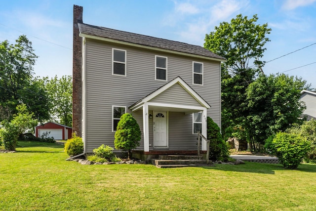 490 Richmond Rd, Bangor, PA 18013 - view of front facade with a chimney, a detached garage, and a front lawn
