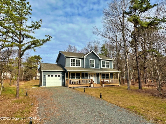 view of front facade with driveway, a shingled roof, an attached garage, covered porch, and a front yard