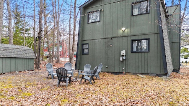 1150 Country Place Dr, Tobyhanna, PA 18466 - rear view of property featuring an outdoor fire pit, an outbuilding, and a storage shed