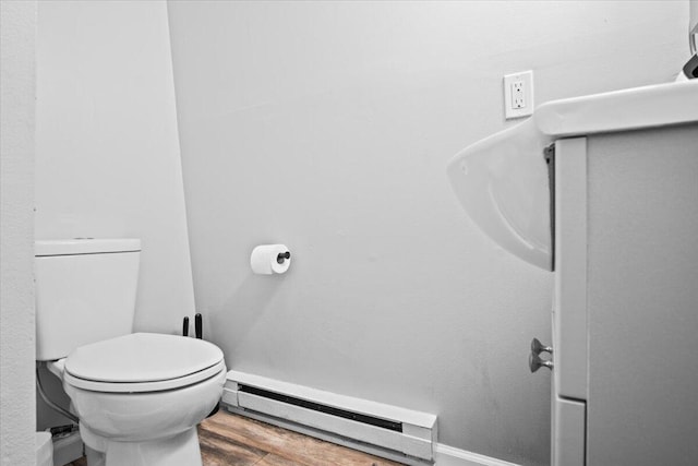 1150 Country Place Dr, Tobyhanna, PA 18466 - bathroom with toilet, baseboards, a baseboard heating unit, and wood finished floors