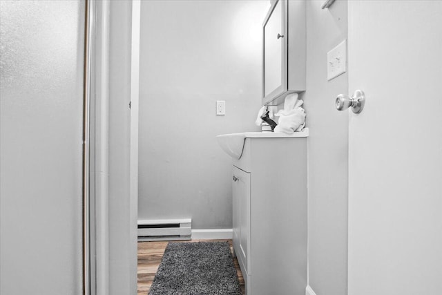 1150 Country Place Dr, Tobyhanna, PA 18466 - bathroom with baseboards, wood finished floors, and baseboard heating