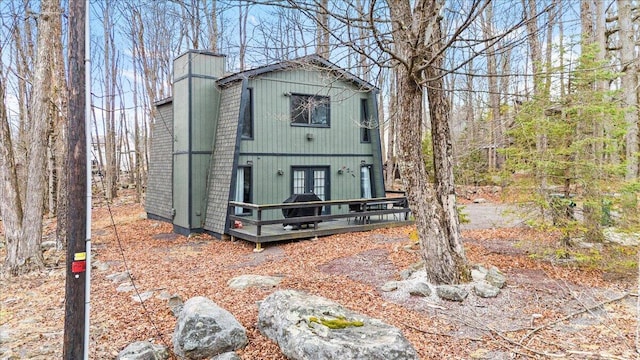 1150 Country Place Dr, Tobyhanna, PA 18466 - rear view of property featuring a chimney, a deck, and french doors