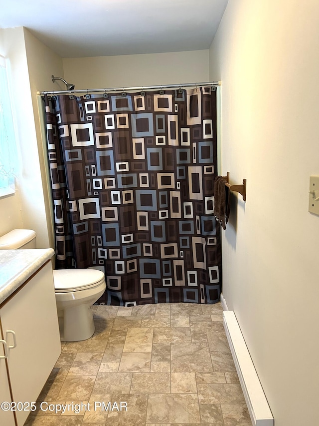 bathroom with vanity, walk in shower, and toilet