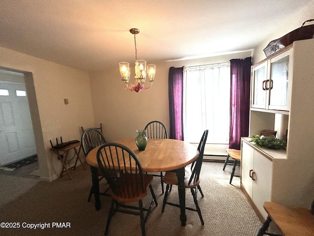 carpeted dining area with an inviting chandelier and baseboard heating