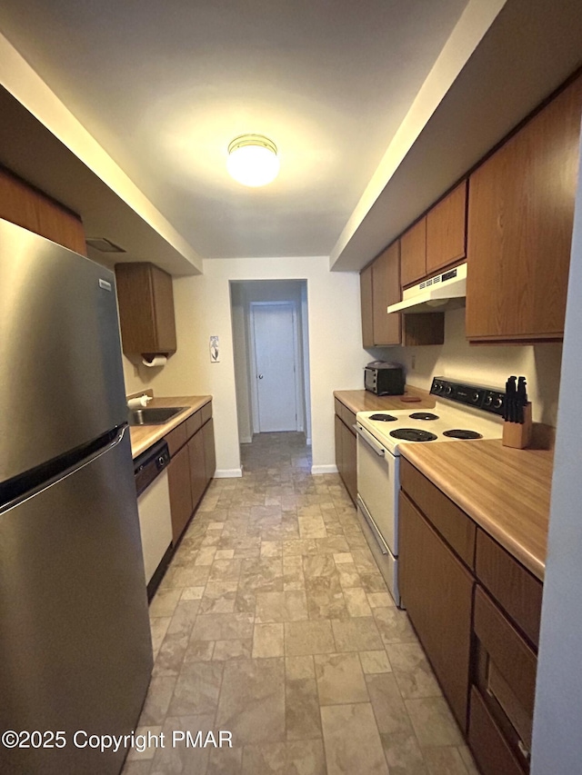 kitchen with sink and white appliances