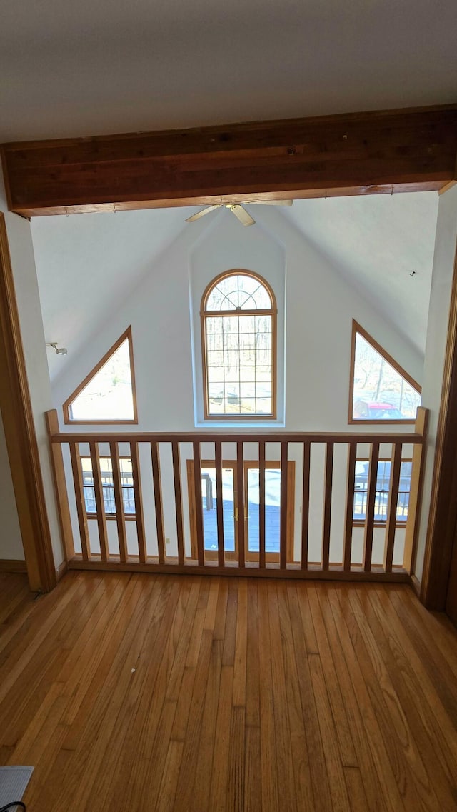 details with beamed ceiling, a ceiling fan, and wood finished floors