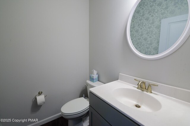 bathroom with vanity and toilet