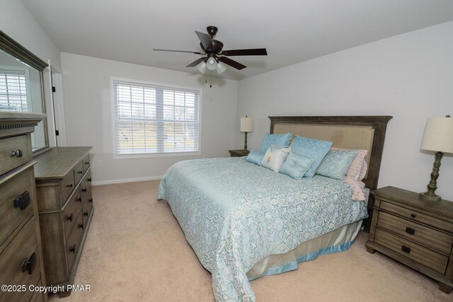 carpeted bedroom with multiple windows and ceiling fan