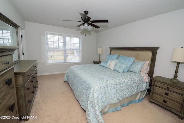 bedroom featuring multiple windows, light carpet, baseboards, and ceiling fan