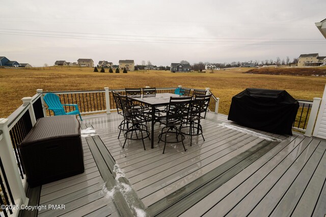 wooden terrace featuring area for grilling