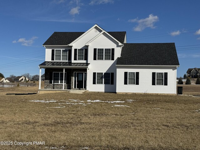 view of front property featuring a porch and a front lawn