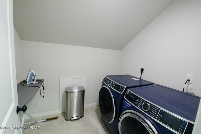 laundry room with washer and dryer