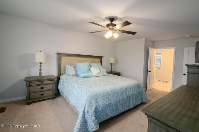 bedroom featuring light colored carpet and ceiling fan