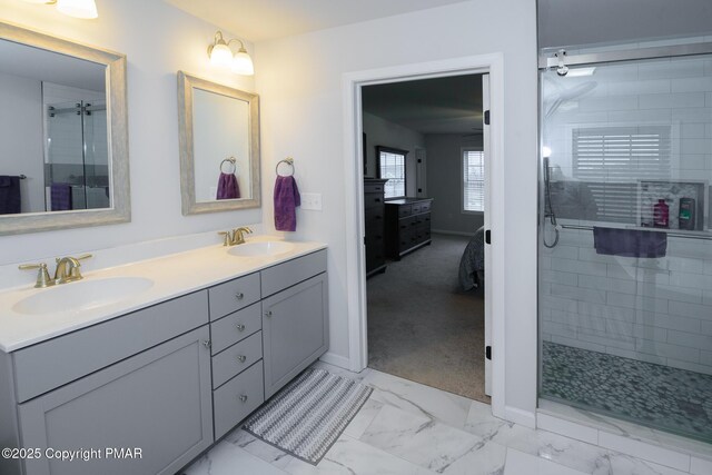 bathroom featuring vanity and a shower with door