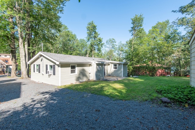 115 Squaw Trl, Pocono Lake, PA 18347 - view of front facade with a front lawn and gravel driveway