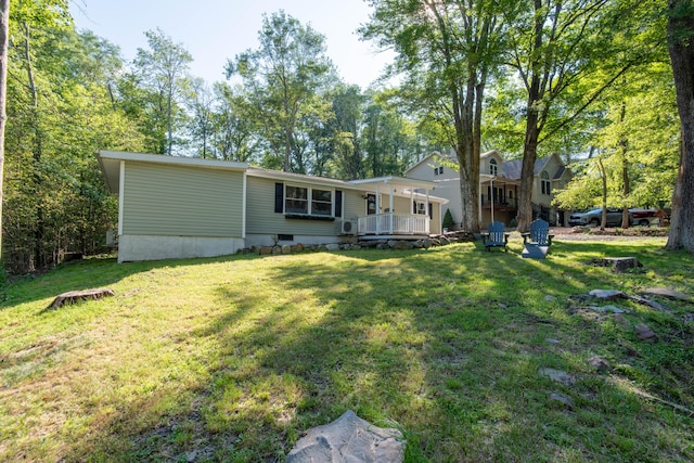 115 Squaw Trl, Pocono Lake, PA 18347 - rear view of property with a yard