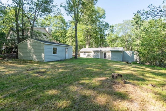 115 Squaw Trl, Pocono Lake, PA 18347 - view of green lawn featuring an outdoor structure