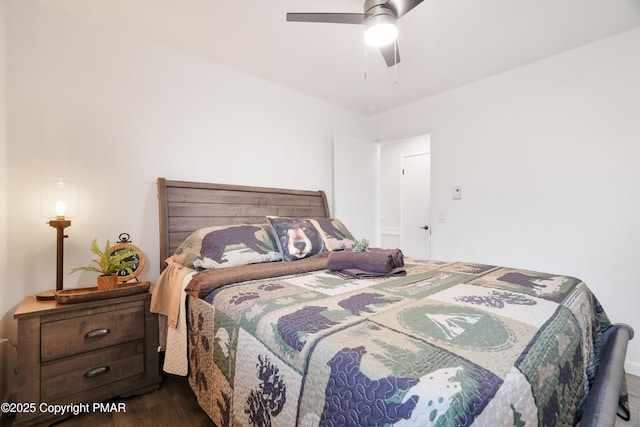 bedroom with ceiling fan and dark hardwood / wood-style flooring