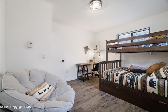 bedroom with wood-type flooring