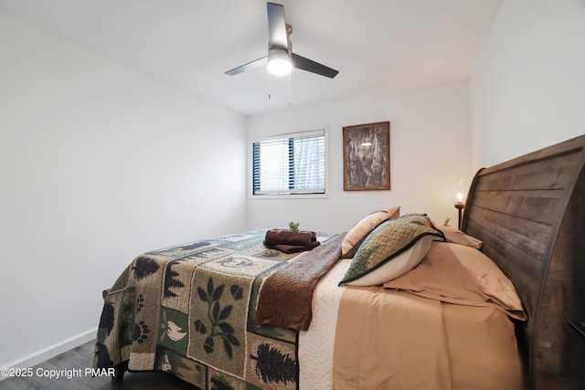 bedroom featuring hardwood / wood-style flooring and ceiling fan