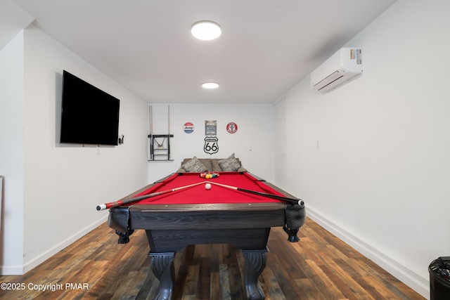 game room featuring dark hardwood / wood-style flooring, pool table, and a wall mounted AC