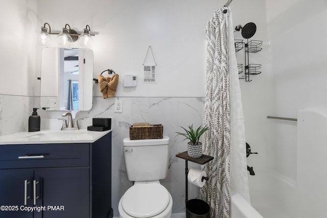 full bathroom featuring shower / tub combo with curtain, vanity, tile walls, and toilet