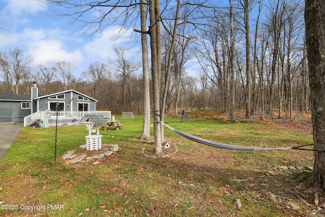 view of yard with a wooden deck