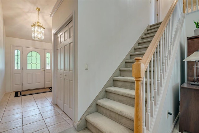 1319 Poulos Ct, Stroudsburg, PA 18360 - entrance foyer with a chandelier, stairs, and light tile patterned floors