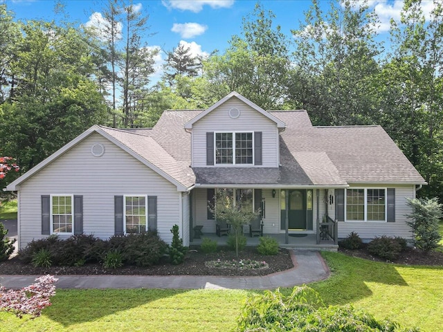 1319 Poulos Ct, Stroudsburg, PA 18360 - view of front of home with a front lawn, roof with shingles, and covered porch