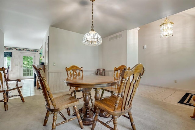 1319 Poulos Ct, Stroudsburg, PA 18360 - dining space featuring light tile patterned floors, light colored carpet, and a chandelier