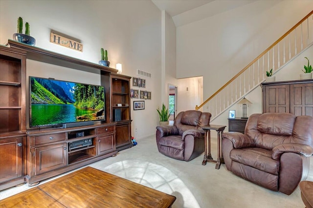 1319 Poulos Ct, Stroudsburg, PA 18360 - living room with stairs, light carpet, and high vaulted ceiling