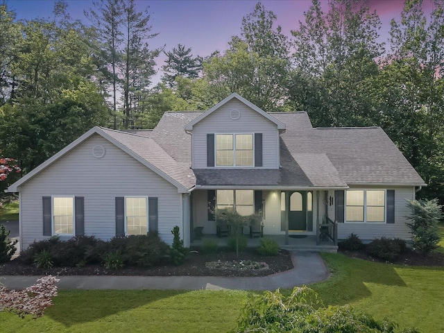 1319 Poulos Ct, Stroudsburg, PA 18360 - traditional-style home with a lawn, a shingled roof, and a porch