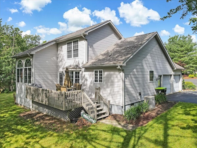 1319 Poulos Ct, Stroudsburg, PA 18360 - back of house with a lawn, a deck, asphalt driveway, a garage, and a shingled roof