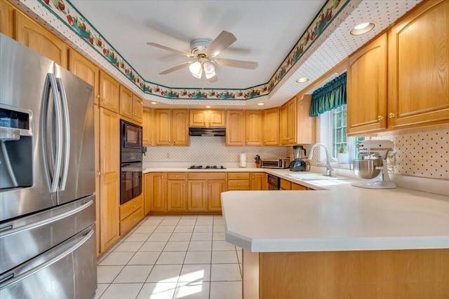 1319 Poulos Ct, Stroudsburg, PA 18360 - kitchen with black appliances, under cabinet range hood, light countertops, a ceiling fan, and tasteful backsplash
