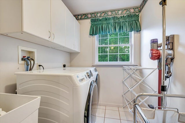 1319 Poulos Ct, Stroudsburg, PA 18360 - laundry room with cabinet space, washing machine and dryer, and light tile patterned floors