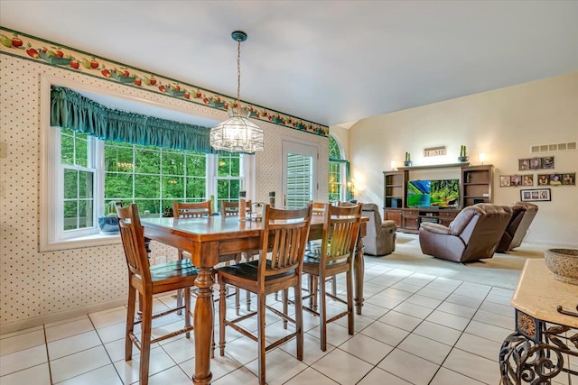 1319 Poulos Ct, Stroudsburg, PA 18360 - dining area featuring a chandelier, wallpapered walls, and light tile patterned floors