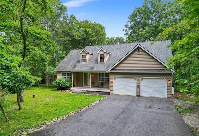 cape cod home with aphalt driveway, a porch, a shingled roof, a garage, and a front lawn