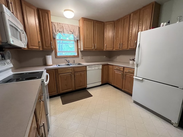 2291 Mountain Rd, Stroudsburg, PA 18360 - kitchen with white appliances, a sink, light flooring, light countertops, and brown cabinetry