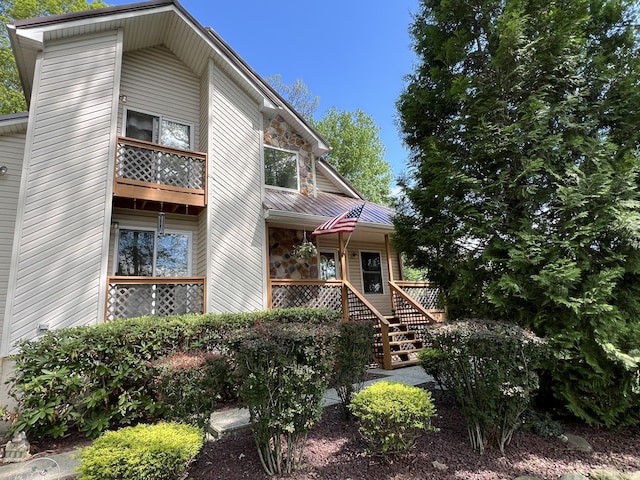 2291 Mountain Rd, Stroudsburg, PA 18360 - view of front facade featuring metal roof, a balcony, covered porch, and a standing seam roof