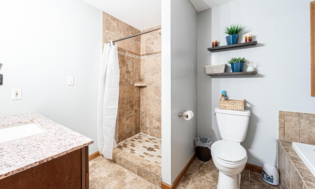 1154 Park Dr, East Stroudsburg, PA 18302 - bathroom with vanity, a tile shower, a garden tub, and tile patterned flooring